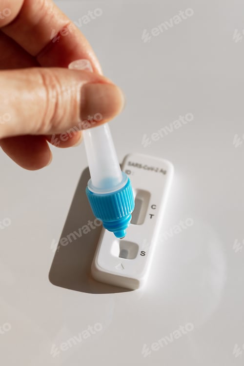 Preview: conducting a covid and disease test with a set and arm on a white background
