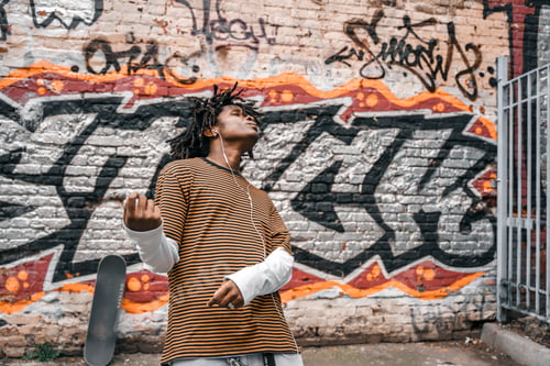 Preview: Portrait of young handsome dancing stylish black man with natural hair afro dreadlocks. Afroamerican