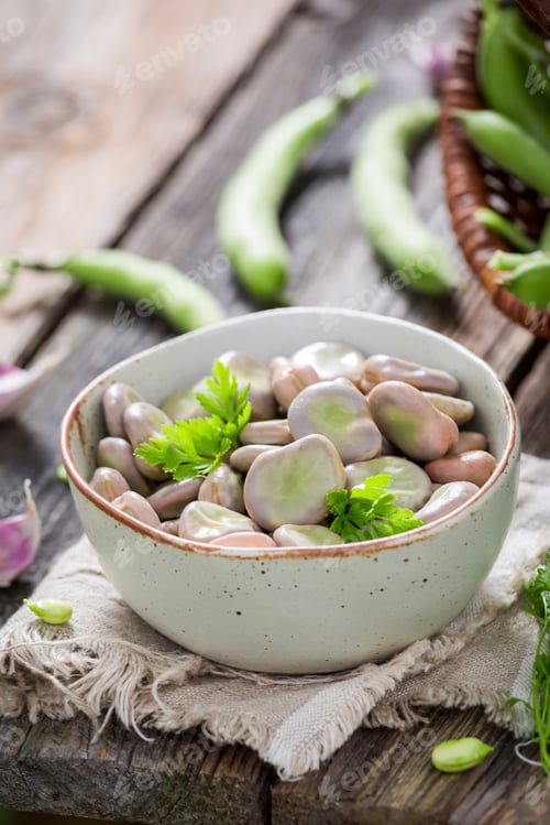 Preview: Closeup of broad beans on old wooden table