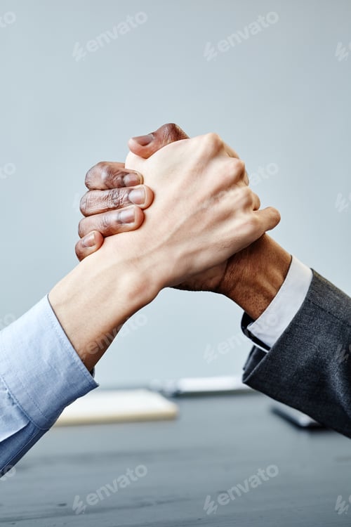 Preview: Business Partners Shaking Hands in Meeting