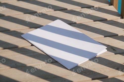 Preview: magazine mockup on rustic wooden background with shadow stripes