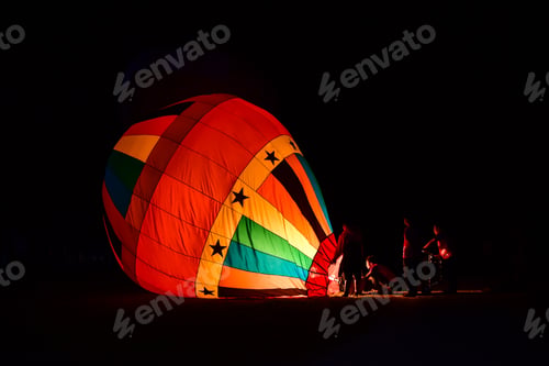 Preview: The team is preparing a balloon with a fire to make the balloon rise.