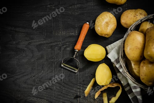 Preview: Fresh potatoes. On black background.