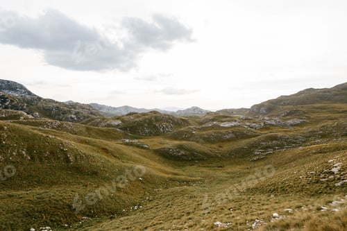 Preview: Green valley near the Sedlo pass in Durmitor National Park against the sky