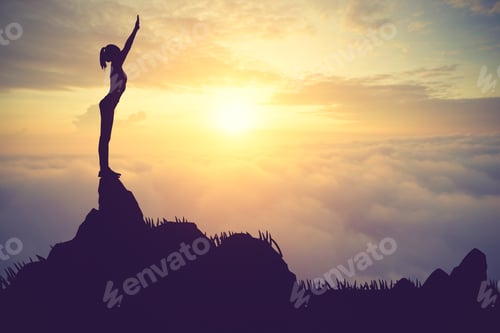 Preview: Silhouette Young Woman Practicing Yoga On The Muontain At Sunset.Vintage Color