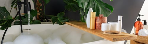Preview: Wooden shelf for beauty and body care products on wooden shelf over modern white bubble filled