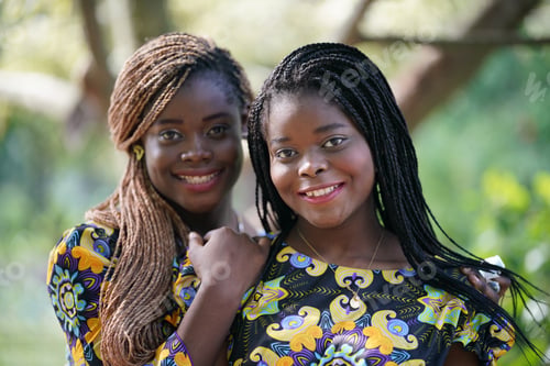 Preview: Portrait of young African American woman smiling at camera.