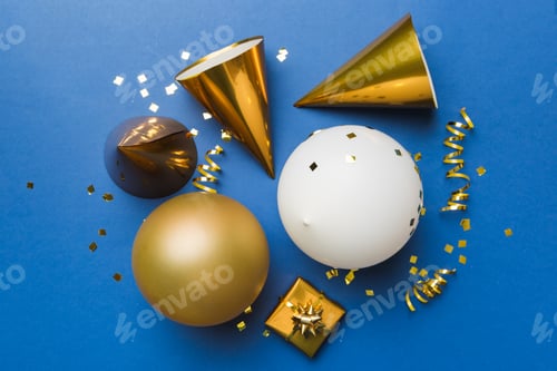Preview: Holiday background with colorful balloon, gift and confetti. Flat lay style.