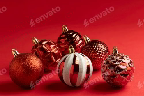 Preview: closeup of christmas balls on a red background