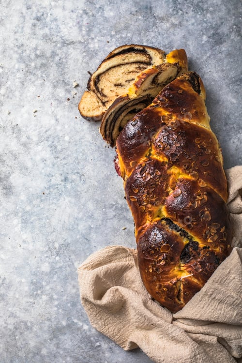 Preview: Traditional Greek Easter bread - tsoureki sliced Sweet marbled brioche plait with nuts and chocolate