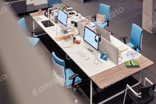 Preview: Desk in modern office with blank monitors