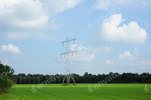 Preview: Pylon in the middle of scenic field surrounded by trees