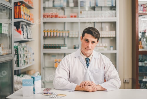 Preview: Male pharmacist posing confidently welcoming, advising patients