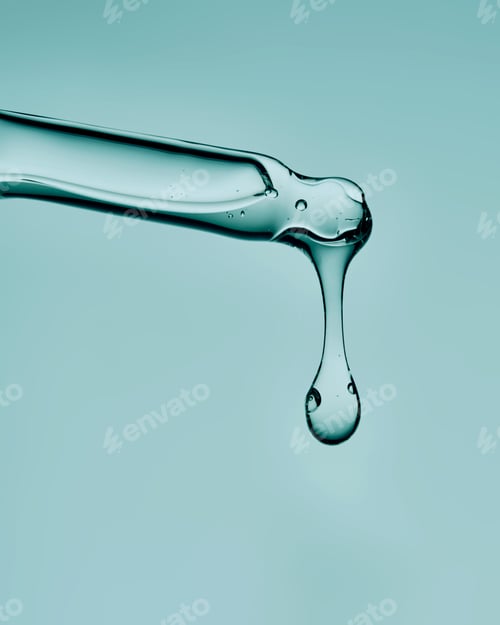 Preview: The texture of the serum in a glass cosmetic pipette. Minimalism.