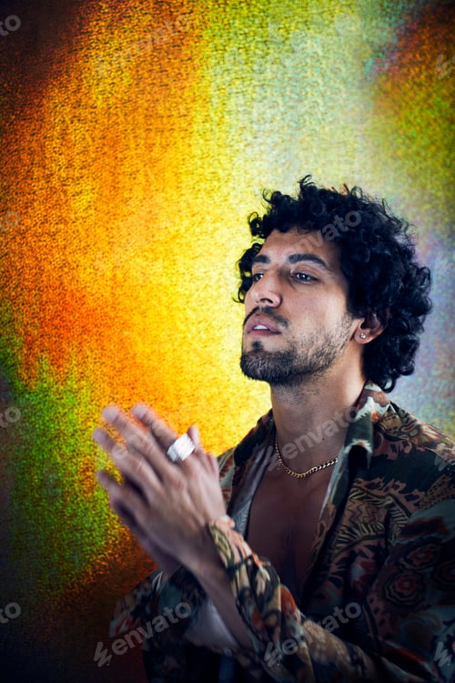 Preview: Studio portrait of mid adult man praying
