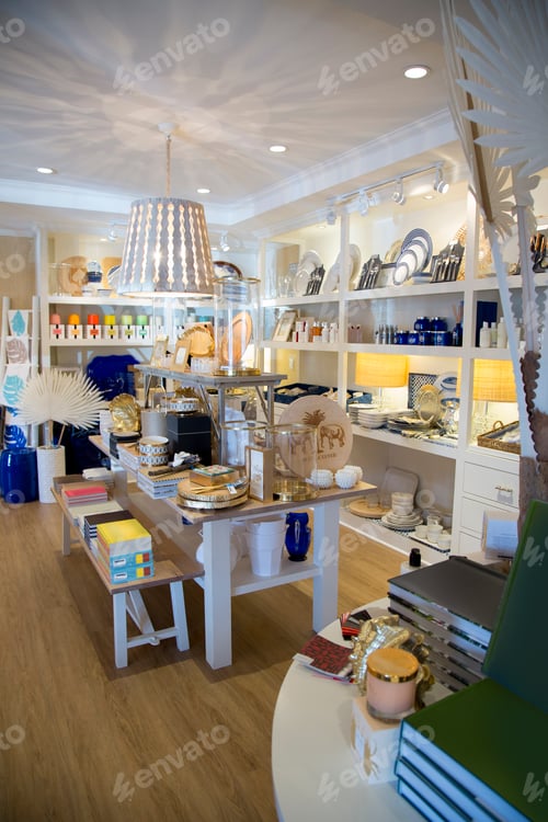 Preview: Shelves with china, books and ornaments in boutique