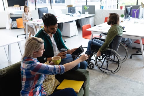Preview: Two diverse business people working in creative office