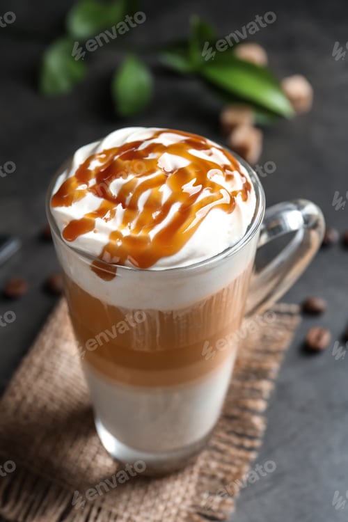 Preview: Glass cup with delicious caramel frappe on table