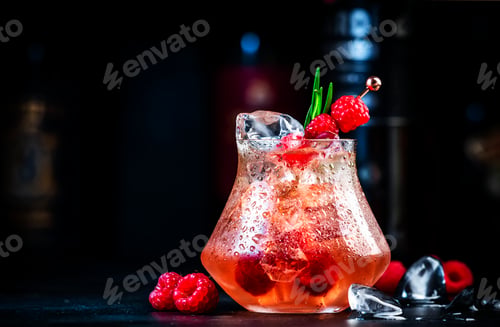 Preview: Pink rum - cocktail drink with white rum, pineapple juice, cranberries, raspberries, rosemary