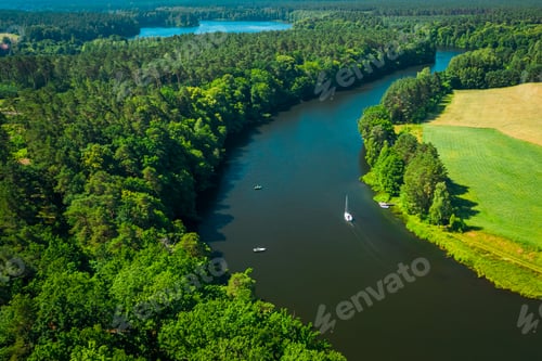 Preview: White boat on a river among forests in summer, Poland
