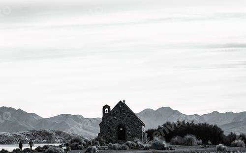 Preview: Famous Church of the Good Shepherd with mountain and clump grass at Lake Tekapo, New Zealand