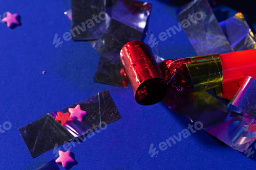 Preview: Close up of a party whistle on a purple background