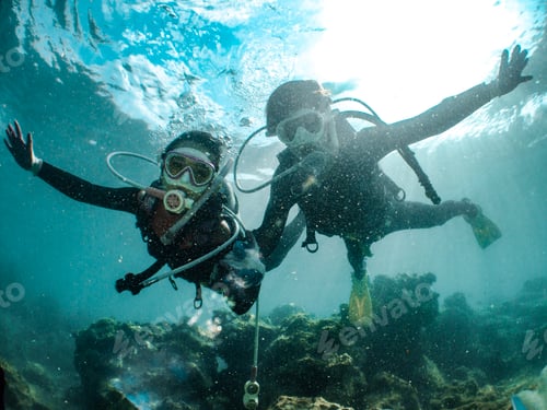 Preview: Underwater shot of two people diving