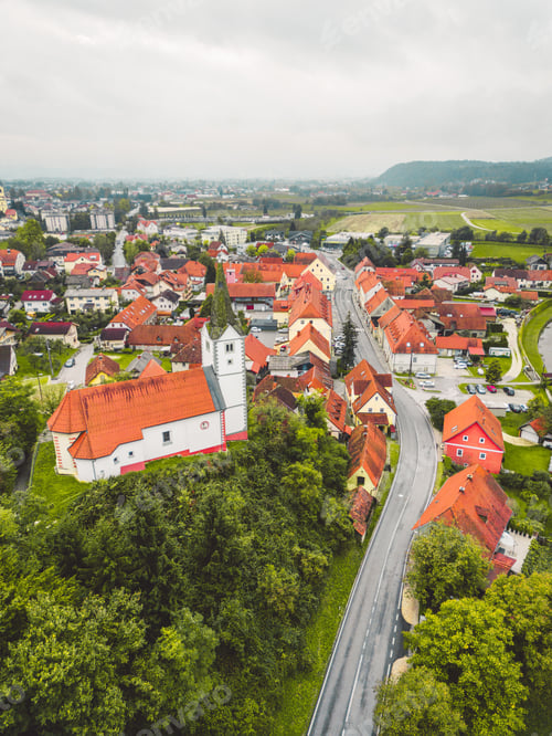 Preview: Vertical photo of old historical town with a church on the hill