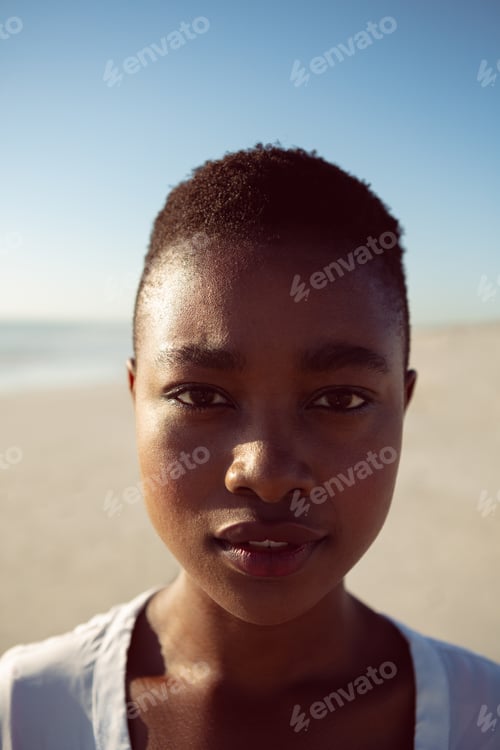 Preview: Portrait of beautiful African-american woman standing on the beach