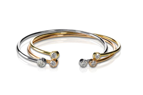 Preview: Set of three colored gold and diamond bracelets stacked
