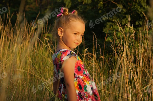 Preview: Beautiful little girl walking in the park