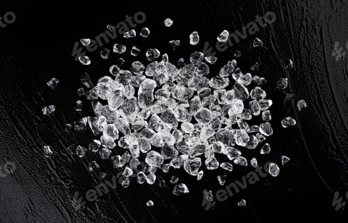 Preview: Crushed ice on black stone background, top view