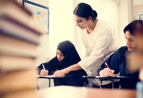 Preview: Diverse Muslim girls studying in classroom