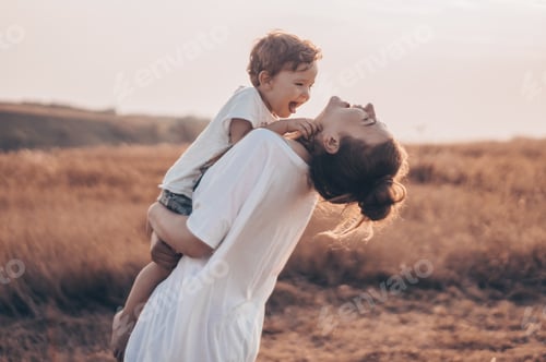 Preview: Mother and little son having good time in the nature