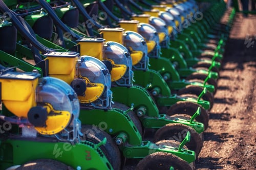 Preview: Tractor plowing farm field in preparation for spring planting
