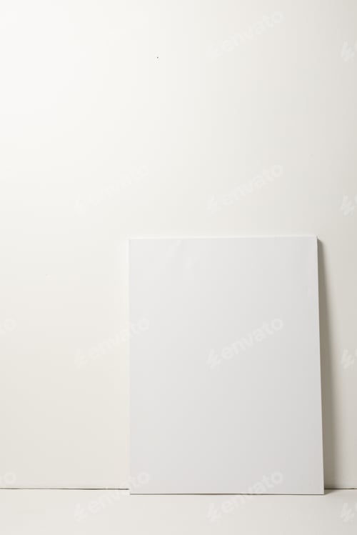Preview: White canvas and copy space leaning against white wall background