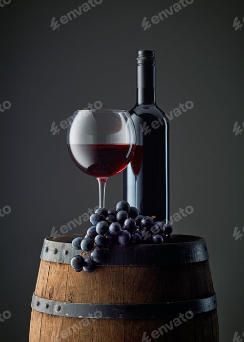 Preview: bottle and glass of red wine