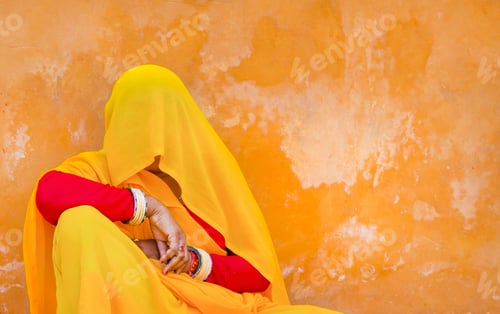 Preview: Woman wearing red and yellow sari and veil