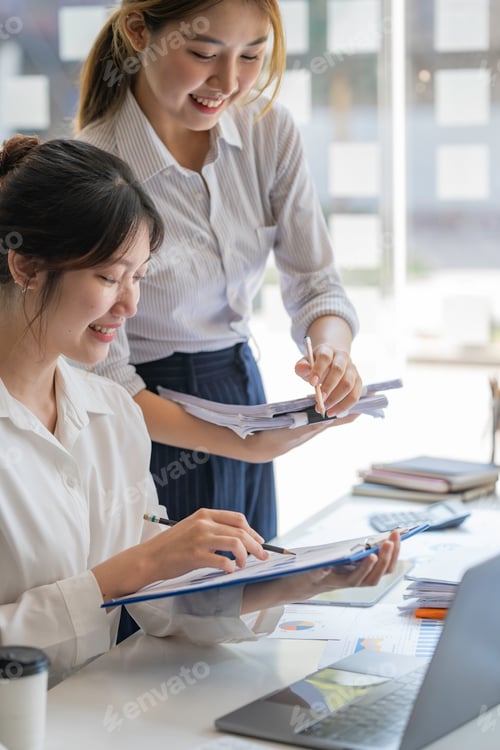 Preview: business woman or accountant who are using a calculator to calculate business data Accounting docume