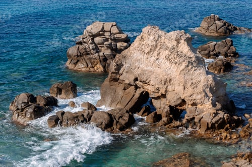 Preview: Waves on rocky beach, sea shore with waves crushing over the big rocks