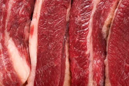 Preview: Texture or background steak beef. Raw steak New York with rosemary and spices on a piece of parchmen