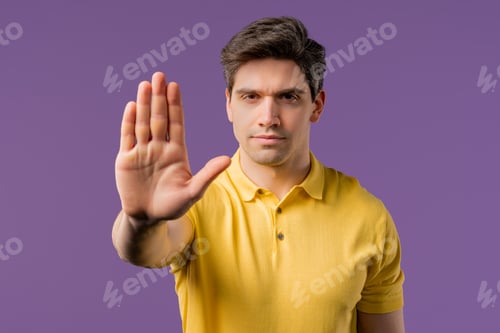 Preview: Serious Man Showing Rejecting Gesture By Stop Palm Sign. Not Allow, Prohibition