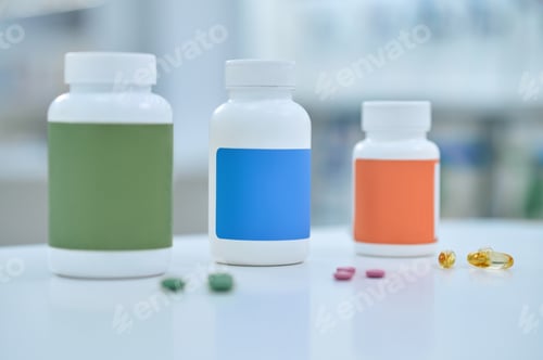 Preview: Oblong and round tablets scattered on the desk