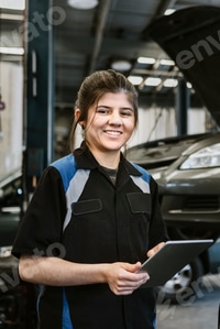 Preview: Happy female car mechanic