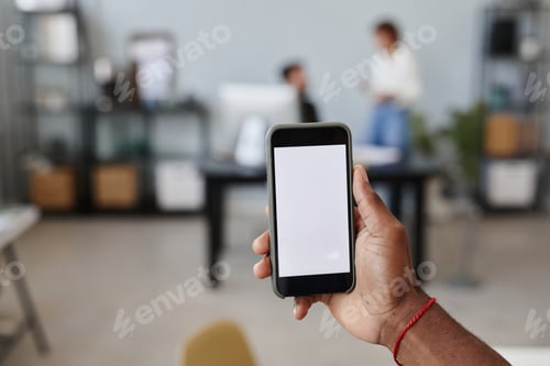 Preview: Man using smart phone at work
