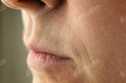 Preview: Female mustache close-up. Mustache above the upper lip of a woman, close-up, selective focus