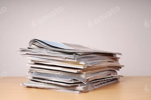 Preview: messy pile of read magazins and catalogs with selective focus and copy space