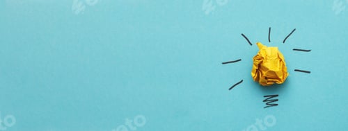 Preview: crumpled yelllow paper laightbulb as a concept creative idea and innovation. banner