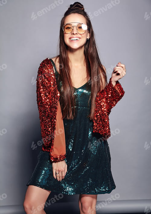 Preview: Portrait of young brunette woman posing in studio