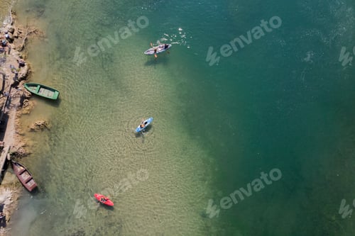 Preview: Several boats on the coast by the river